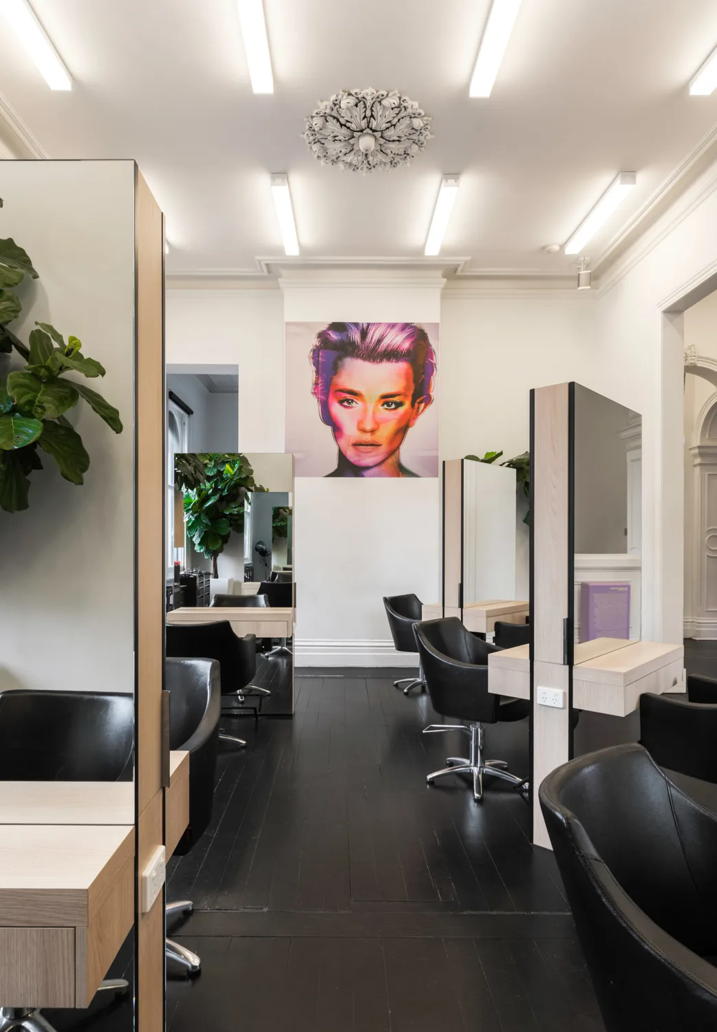 Cream Melbourne — arched doorway, pink pop-art face, row of stations